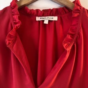 Coral pink frilly blouse